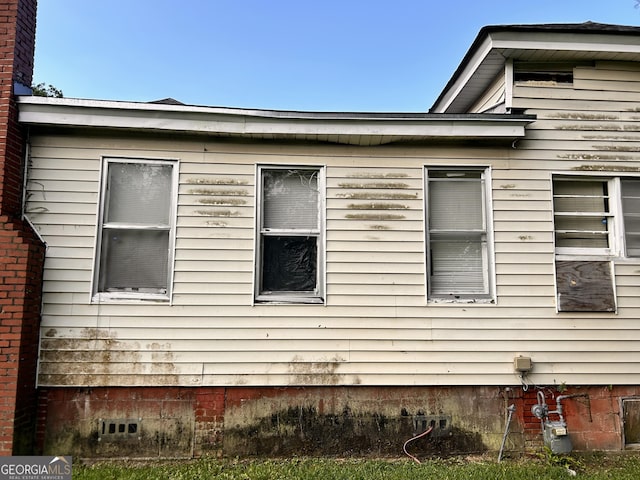 view of side of home featuring crawl space