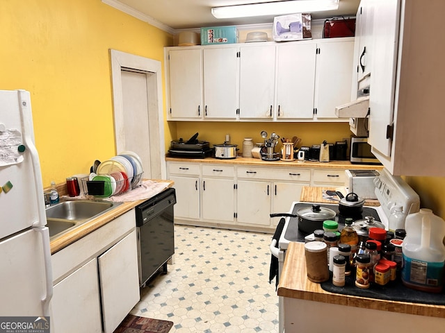 kitchen featuring light floors, freestanding refrigerator, white cabinetry, a sink, and dishwasher