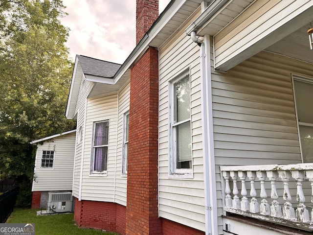 view of side of property with a chimney