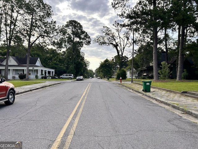 view of road featuring curbs and sidewalks