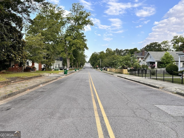 view of street with sidewalks and curbs