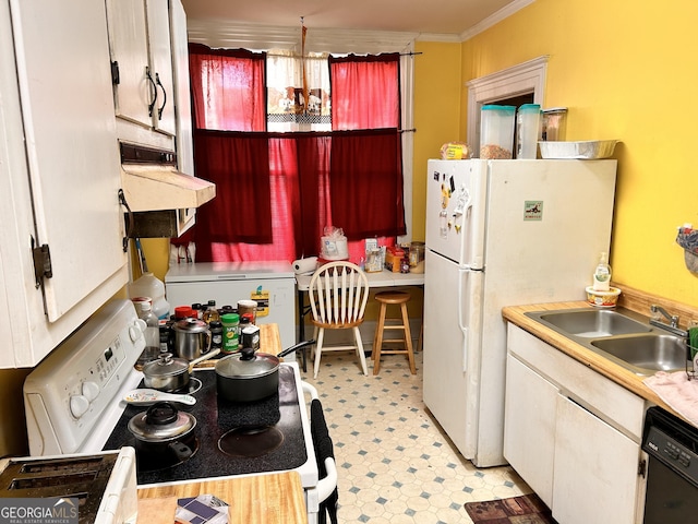 kitchen with white appliances, a sink, white cabinets, light countertops, and range hood