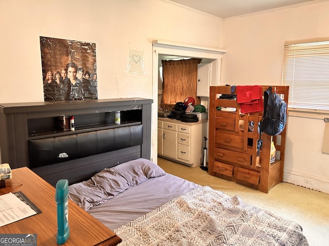 bedroom with light carpet and crown molding