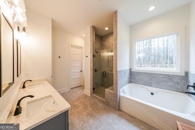 full bath featuring a garden tub, double vanity, a stall shower, and a sink