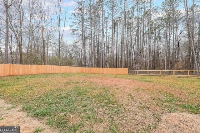 view of yard with fence