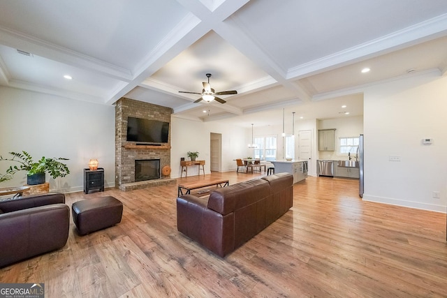 living area with light wood-type flooring, coffered ceiling, and beamed ceiling