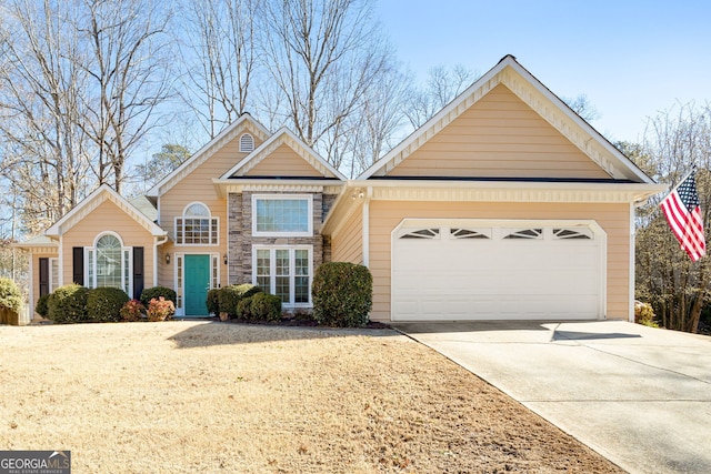 traditional-style house featuring stone siding, driveway, and an attached garage