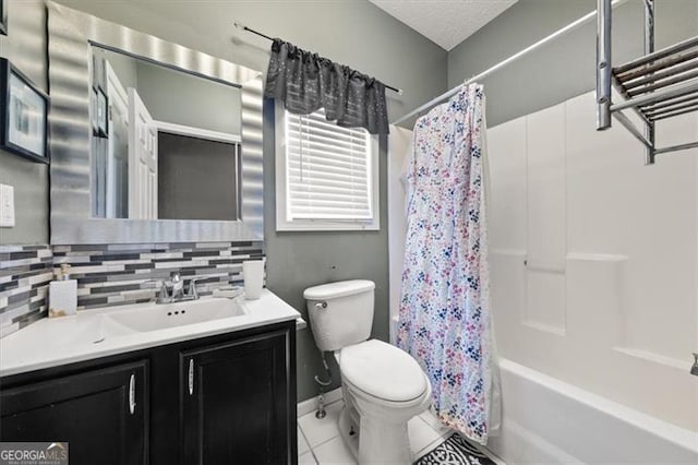 full bathroom featuring tasteful backsplash, toilet, tile patterned floors, shower / bath combo with shower curtain, and vanity