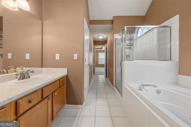 bathroom featuring a garden tub, tile patterned flooring, vanity, and a shower stall