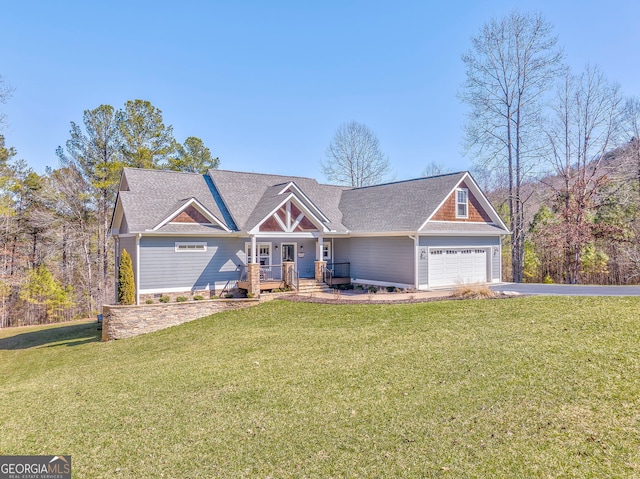 craftsman-style home featuring a garage, a front yard, and driveway