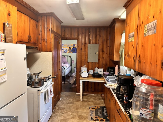 kitchen with brown cabinetry, white appliances, electric panel, and wooden walls