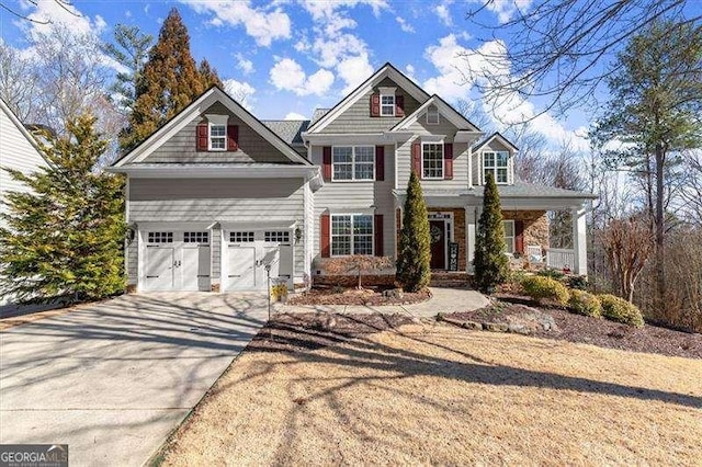 craftsman-style house featuring a garage and driveway