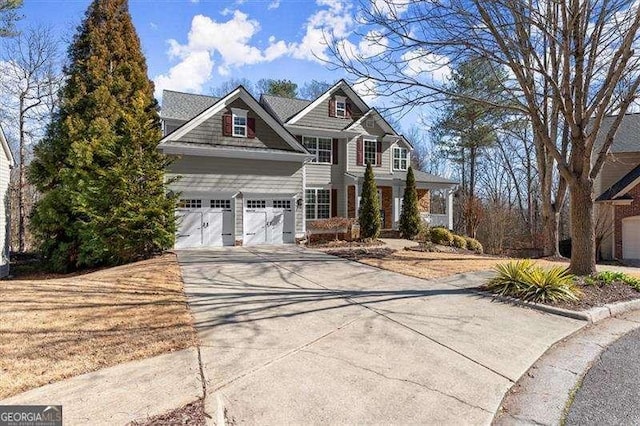 view of front of house with a garage and concrete driveway