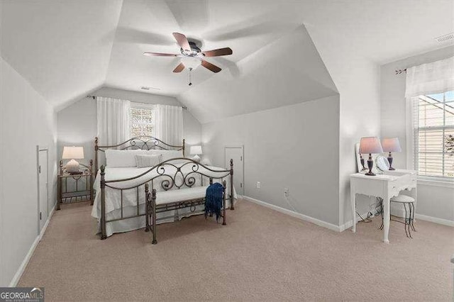 bedroom featuring lofted ceiling, light carpet, ceiling fan, and baseboards