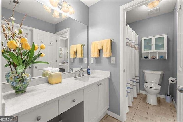 full bath with visible vents, baseboards, toilet, tile patterned flooring, and vanity