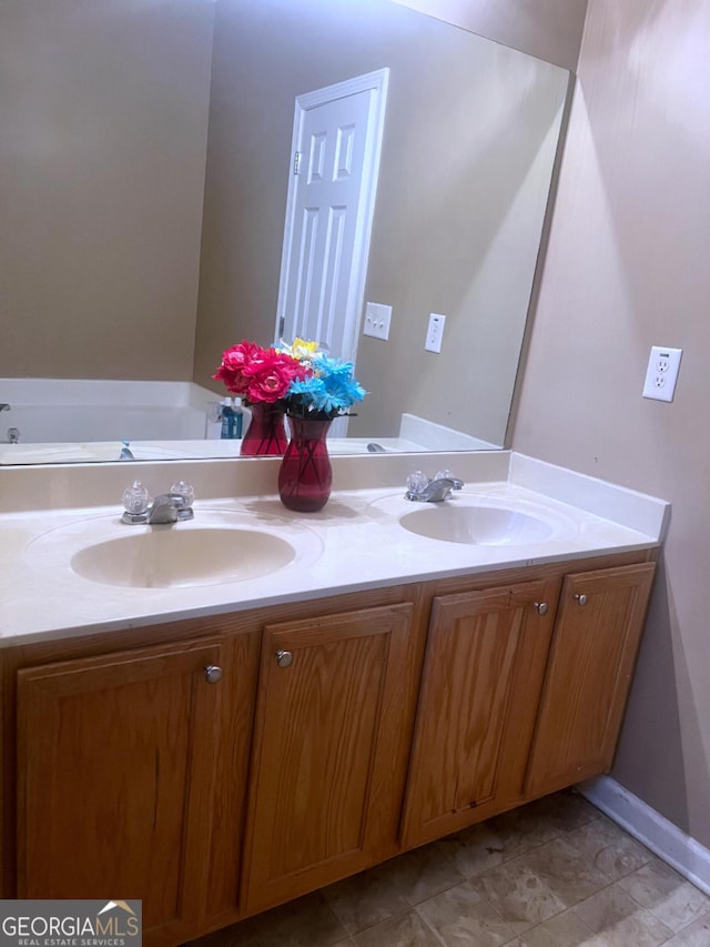 bathroom with double vanity and a sink