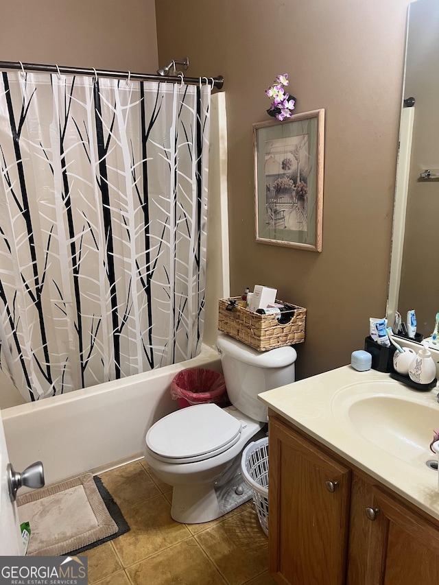 bathroom with vanity, tile patterned floors, toilet, and shower / bath combo