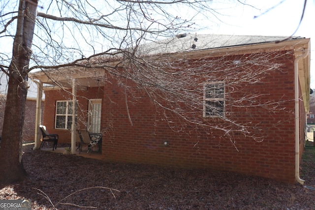 view of home's exterior featuring brick siding