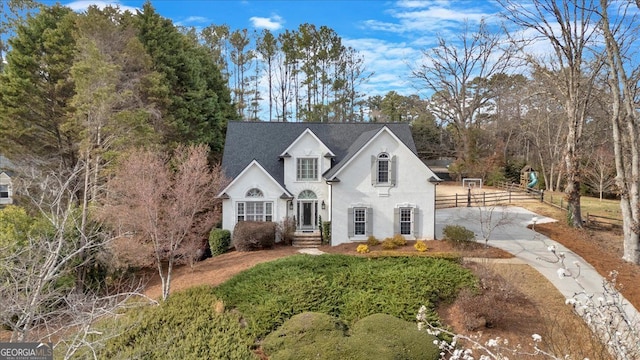 view of front of home featuring concrete driveway and stucco siding