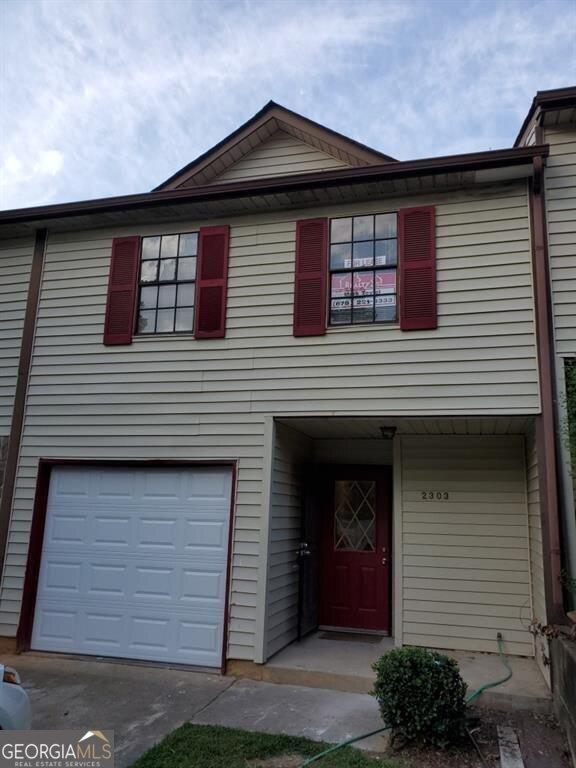 view of property featuring a garage