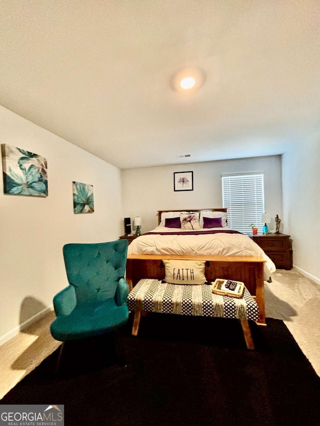 bedroom with carpet flooring and baseboards