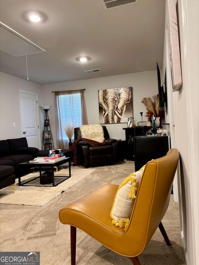 living room featuring attic access, visible vents, carpet flooring, and recessed lighting