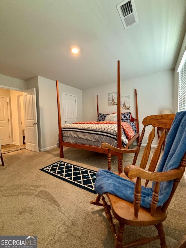 bedroom with baseboards, visible vents, and carpet flooring