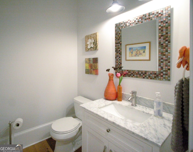 bathroom with vanity and toilet