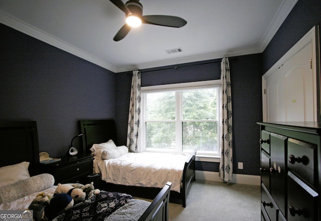 bedroom featuring baseboards, visible vents, crown molding, and light colored carpet