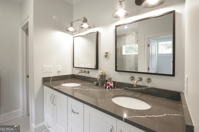 full bathroom featuring double vanity and a sink