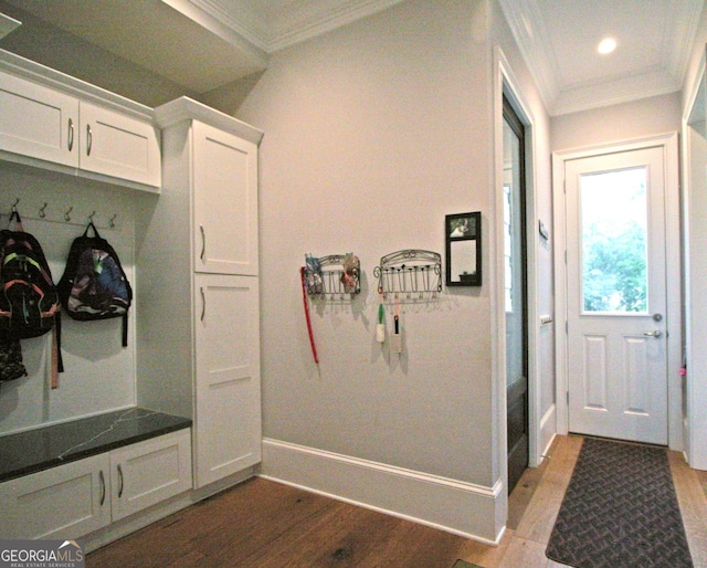 mudroom with baseboards, wood finished floors, and crown molding