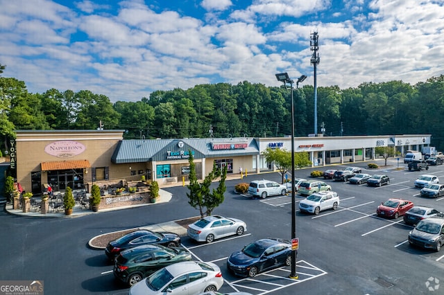 view of building exterior featuring uncovered parking