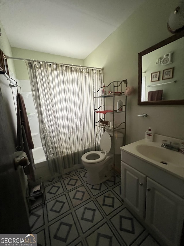 full bathroom featuring toilet, shower / bath combination with curtain, and vanity