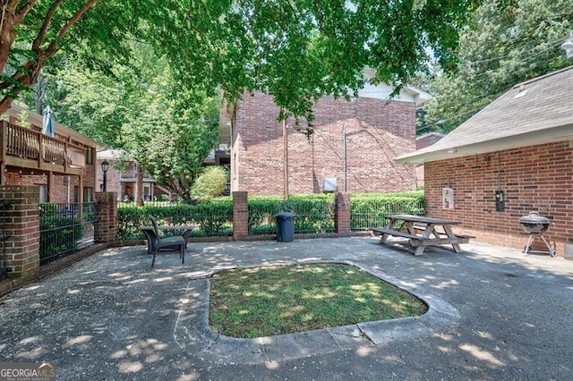 view of patio / terrace featuring area for grilling and fence