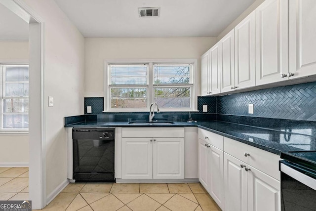 kitchen with light tile patterned floors, a sink, visible vents, white cabinets, and black dishwasher