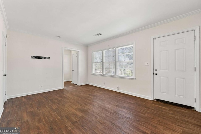 interior space with dark wood-style flooring, visible vents, and crown molding