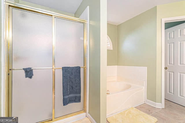 full bathroom with a garden tub, baseboards, a shower stall, and tile patterned floors