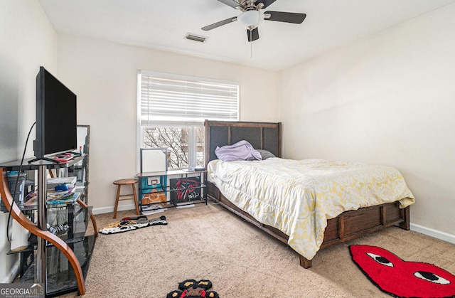 bedroom with baseboards, visible vents, ceiling fan, and carpet flooring