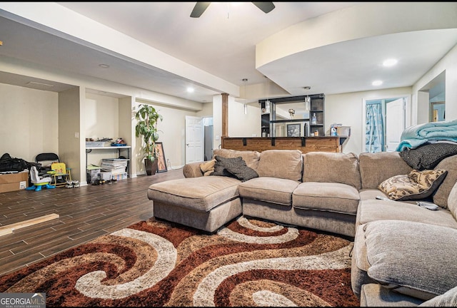 living area with a ceiling fan, recessed lighting, baseboards, and wood finished floors