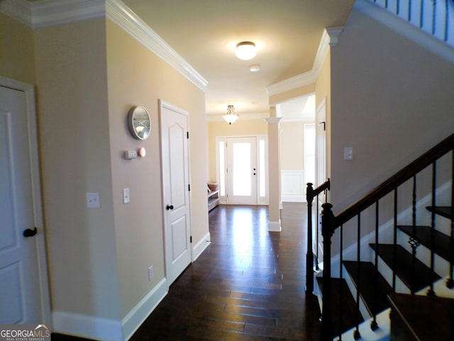 entrance foyer featuring baseboards, stairway, dark wood-style flooring, and crown molding