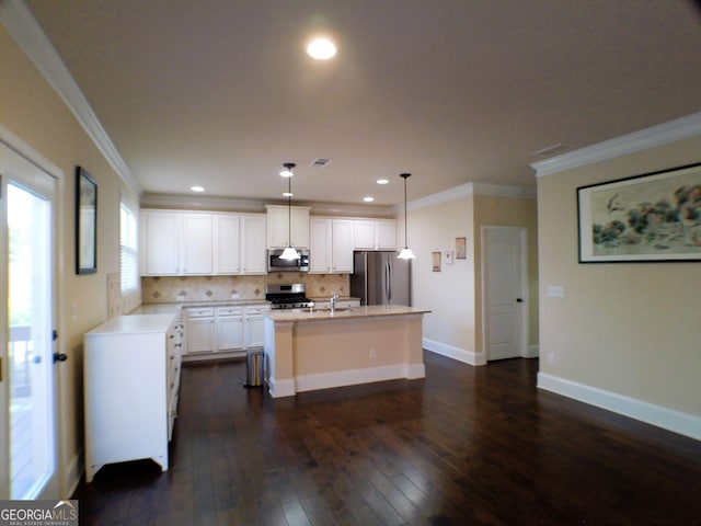 kitchen with appliances with stainless steel finishes, decorative backsplash, dark wood-style floors, a center island with sink, and crown molding