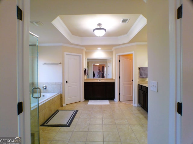 bathroom featuring a raised ceiling, visible vents, ornamental molding, vanity, and tile patterned floors