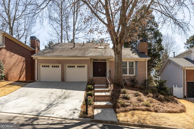 single story home with a garage, brick siding, concrete driveway, roof with shingles, and a chimney