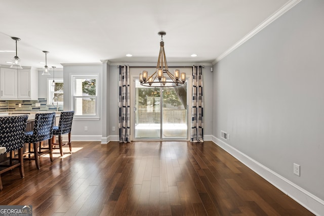 dining area with a chandelier, visible vents, baseboards, dark wood-style floors, and crown molding