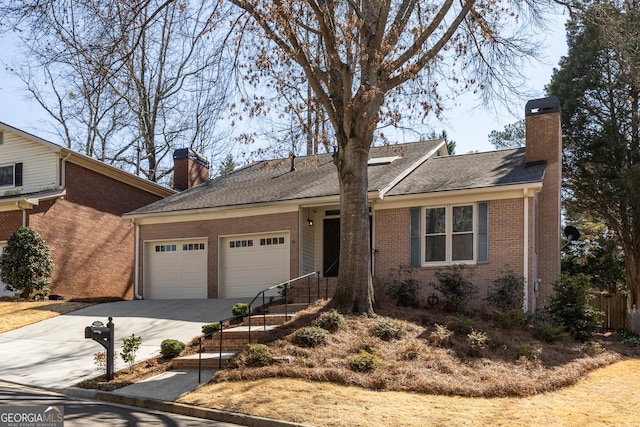 ranch-style home with driveway, a chimney, roof with shingles, an attached garage, and brick siding