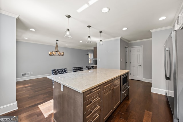 kitchen featuring appliances with stainless steel finishes, dark wood finished floors, visible vents, and crown molding