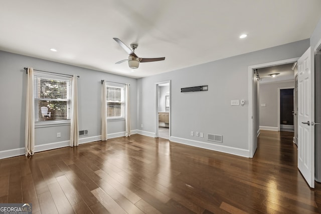 unfurnished bedroom with baseboards, visible vents, and wood finished floors