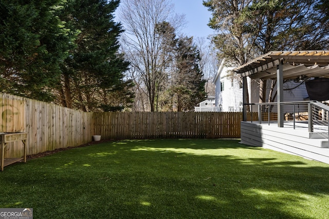 view of yard with a fenced backyard and a pergola