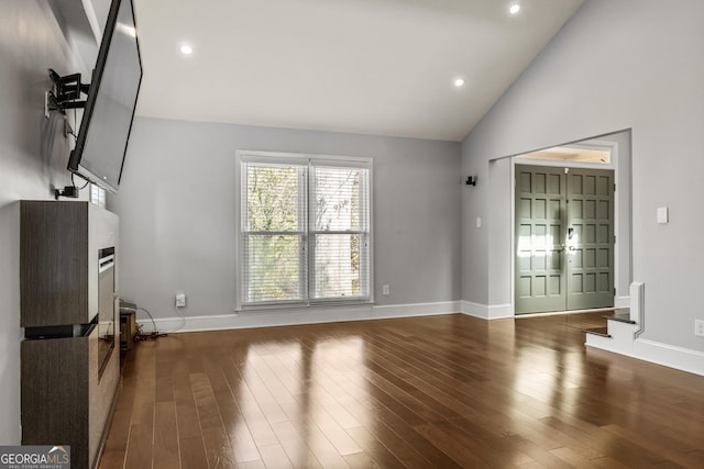 unfurnished living room featuring baseboards, wood finished floors, and recessed lighting