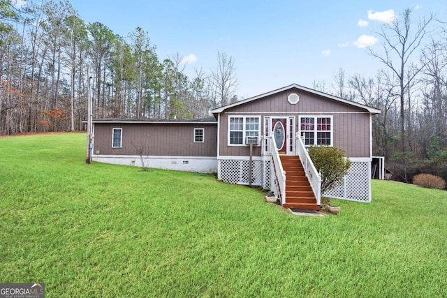 view of front of property with crawl space and a front lawn